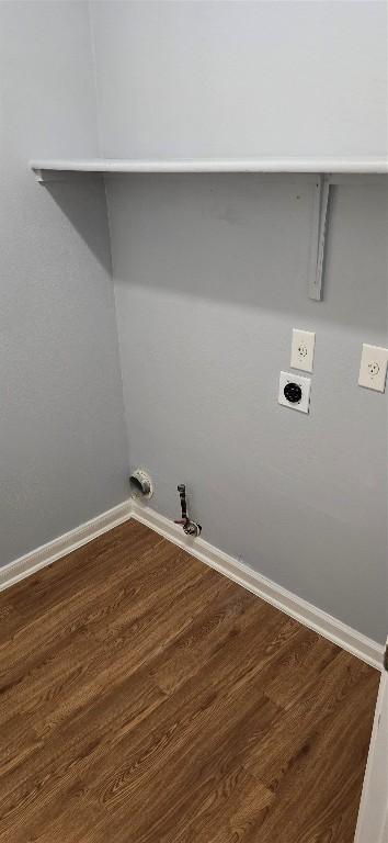 washroom featuring gas dryer hookup, hardwood / wood-style floors, and hookup for an electric dryer