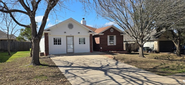 ranch-style house featuring a garage