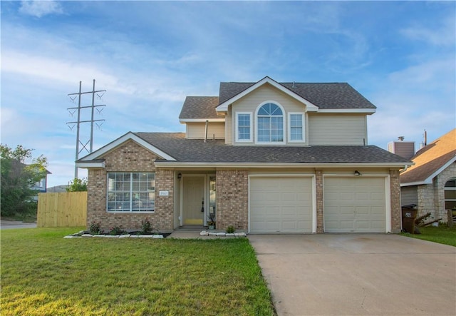 view of front of property featuring a garage and a front yard