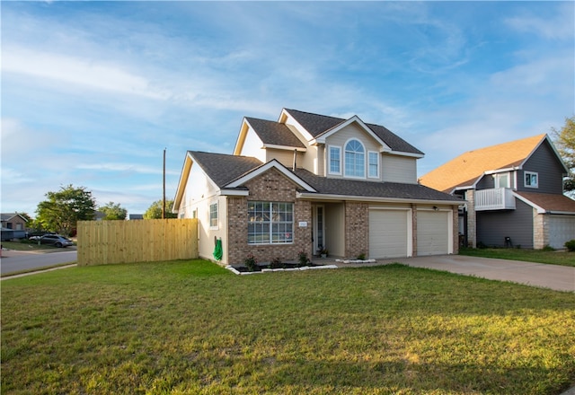 view of front of property with a garage and a front lawn