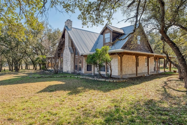 view of side of home with a lawn