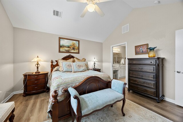 30 Wildwood Dr Unit 41, Georgetown, TX 78633 - bedroom with wood finished floors, baseboards, ensuite bathroom, ceiling fan, and high vaulted ceiling