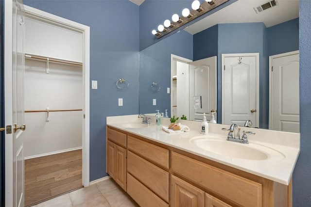 bathroom featuring tile patterned floors and vanity