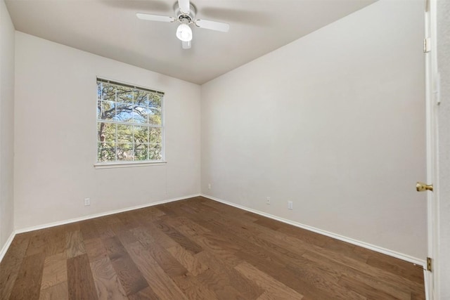 spare room featuring ceiling fan and dark hardwood / wood-style flooring