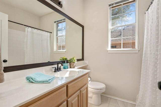 bathroom with vanity, tile patterned floors, and toilet