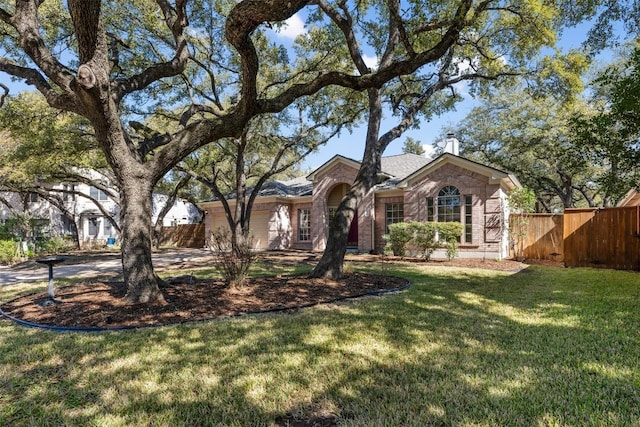 ranch-style house featuring a front lawn