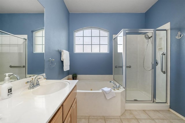 bathroom with vanity, plus walk in shower, and tile patterned flooring