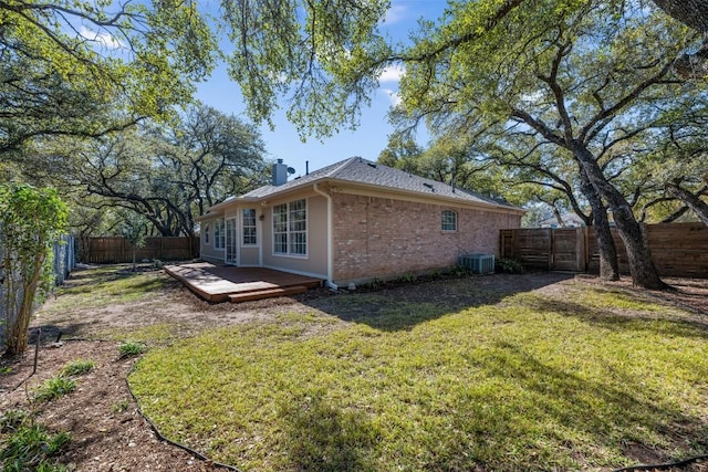 view of home's exterior with a yard and central air condition unit