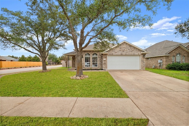 ranch-style home featuring a garage and a front lawn