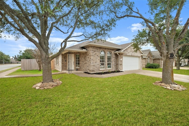 ranch-style home with a garage and a front lawn