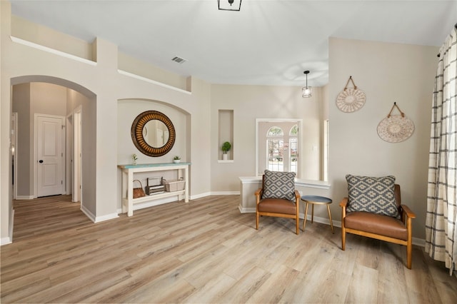 living area with light hardwood / wood-style flooring