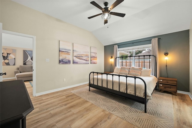 bedroom with vaulted ceiling, ceiling fan, and light hardwood / wood-style floors