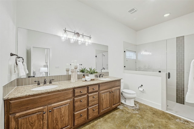 bathroom featuring vanity, toilet, and walk in shower