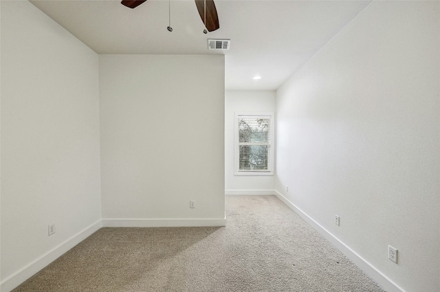 unfurnished room with a ceiling fan, carpet, visible vents, and baseboards