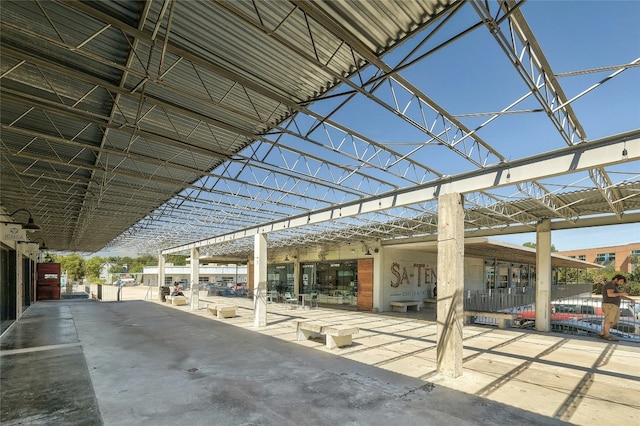 view of patio featuring a lanai