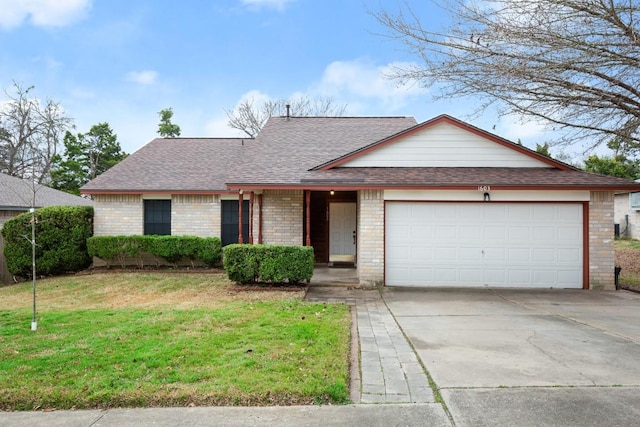 ranch-style home featuring a garage and a front yard