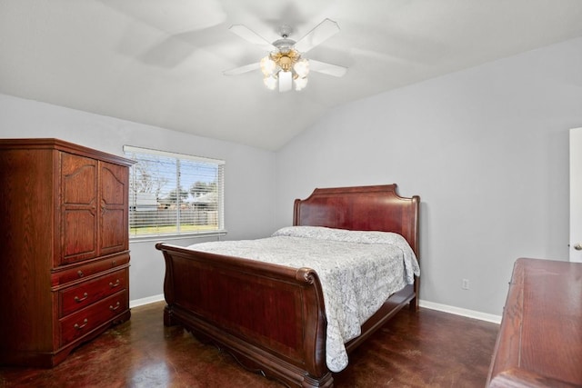 bedroom with lofted ceiling, dark wood-type flooring, and ceiling fan