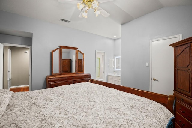 bedroom with ensuite bath and ceiling fan