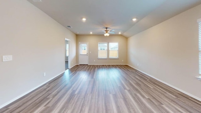 spare room featuring ceiling fan and light hardwood / wood-style flooring