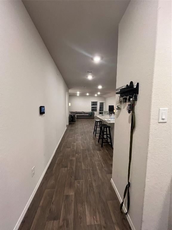 hallway featuring dark hardwood / wood-style flooring