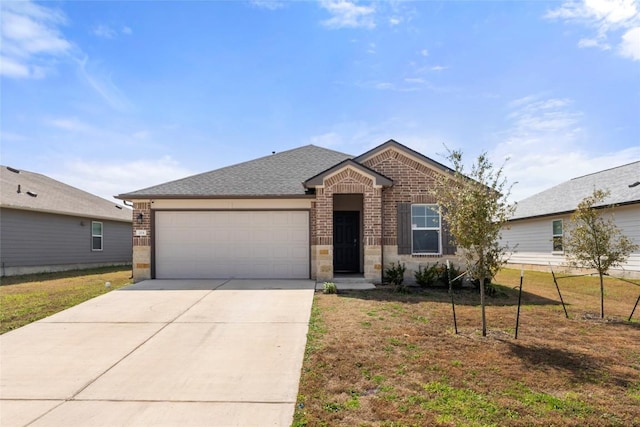 single story home featuring a garage, brick siding, concrete driveway, and a front yard