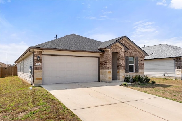 ranch-style home featuring a front lawn, roof with shingles, concrete driveway, a garage, and brick siding