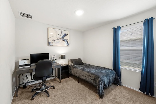 carpeted bedroom with visible vents