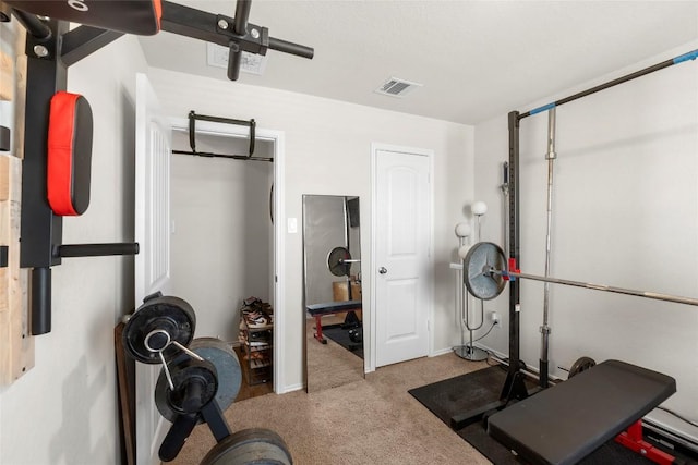 workout room featuring visible vents and carpet floors