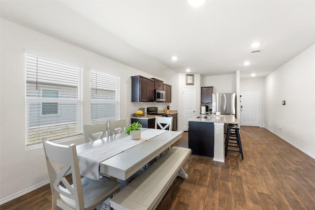 dining room featuring dark wood finished floors, visible vents, recessed lighting, and baseboards