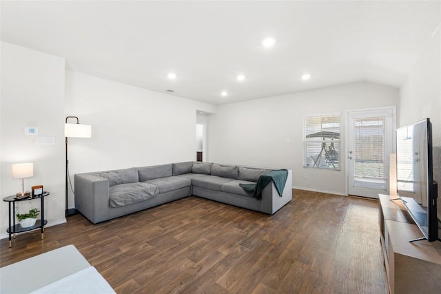 living area with visible vents, dark wood-type flooring, baseboards, lofted ceiling, and recessed lighting