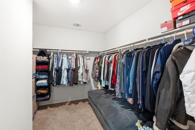 spacious closet featuring carpet flooring and visible vents