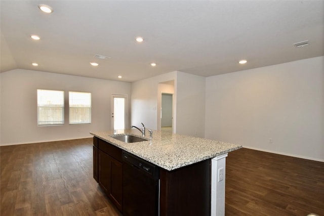 kitchen with dishwasher, sink, light stone countertops, dark wood-type flooring, and a center island with sink