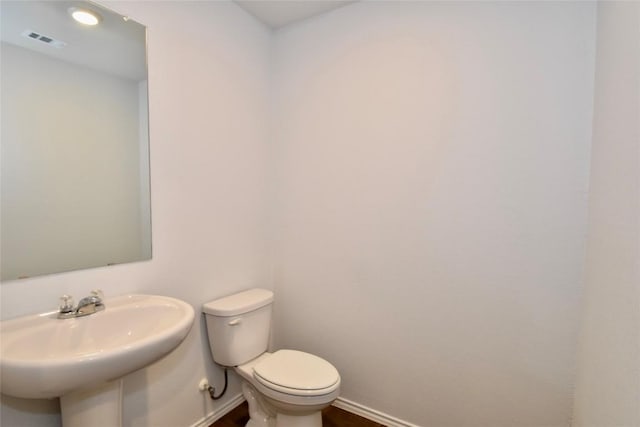 bathroom featuring sink and toilet