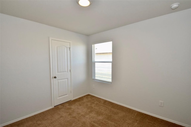 empty room with carpet flooring