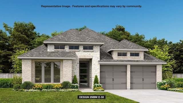 view of front of property with a garage and a front lawn