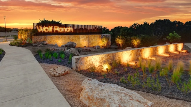 view of pool at dusk