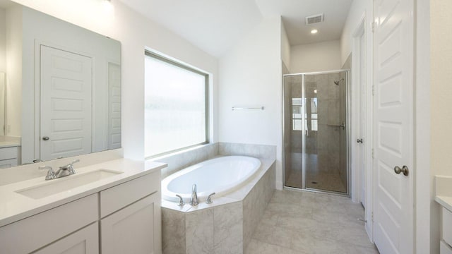 bathroom with tile patterned floors, visible vents, a garden tub, a shower stall, and vanity