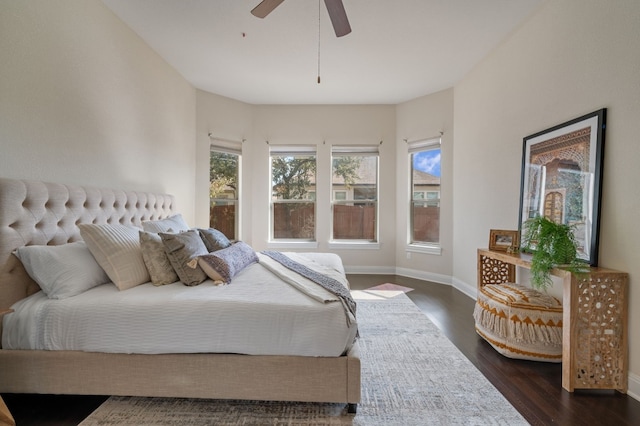 bedroom featuring dark hardwood / wood-style floors and ceiling fan