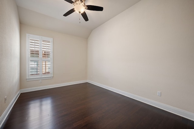 unfurnished room featuring vaulted ceiling, ceiling fan, and dark hardwood / wood-style flooring