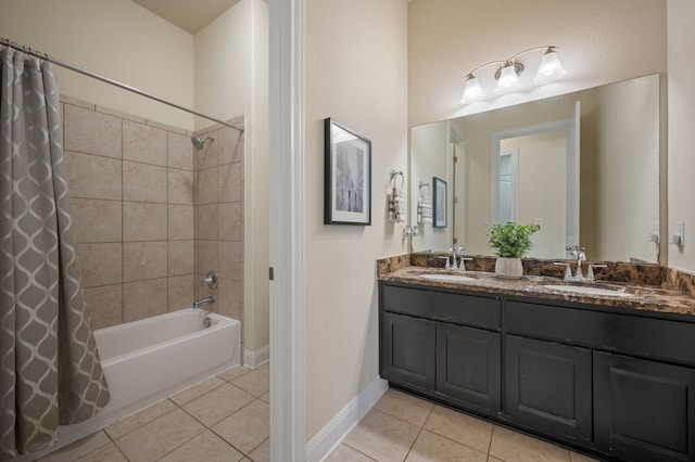 bathroom with shower / bath combo, tile patterned floors, and vanity