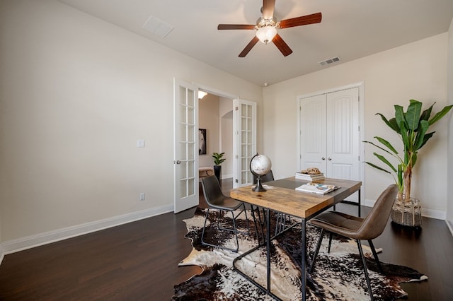 office space with dark wood-type flooring, ceiling fan, and french doors