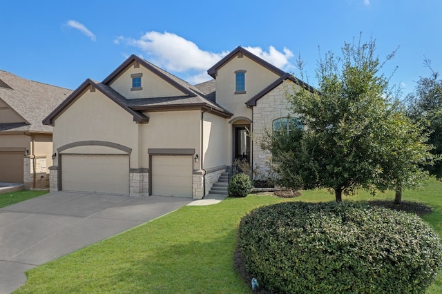 french country style house featuring a garage and a front lawn