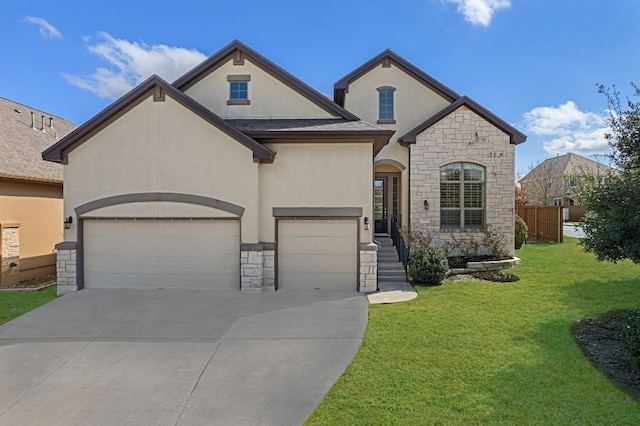 french provincial home with a garage and a front lawn