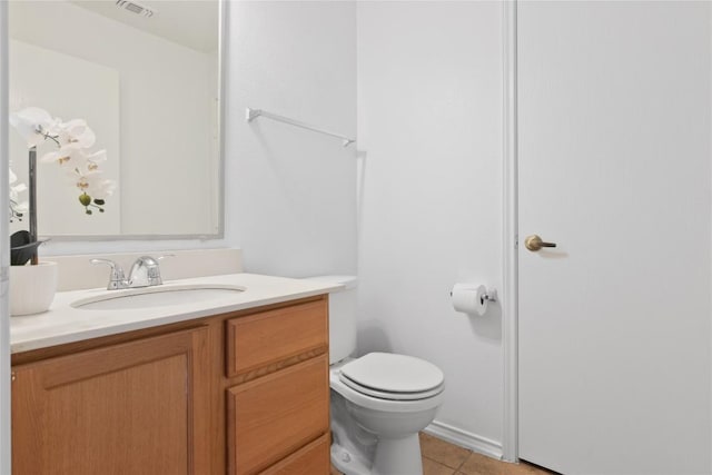 bathroom with tile patterned floors, visible vents, toilet, and vanity