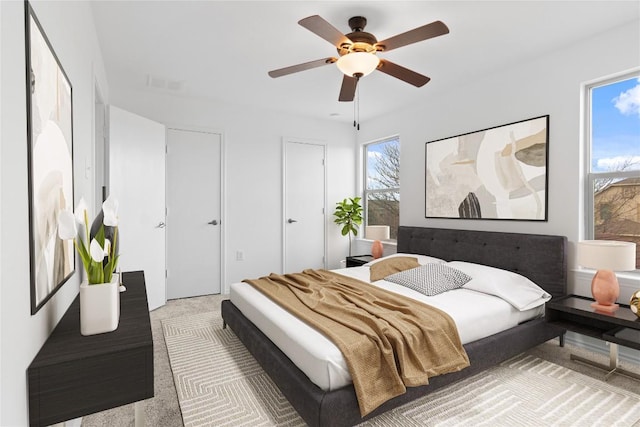 bedroom featuring ceiling fan and carpet floors