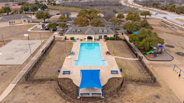 view of swimming pool with fence