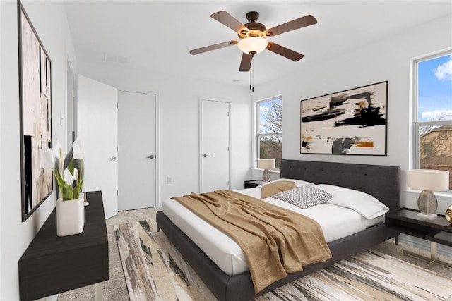 bedroom with visible vents and ceiling fan