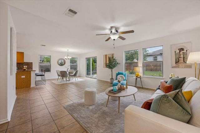 11009 Roderick Lawson Ln, Austin, TX 78754 - living area featuring plenty of natural light, light tile patterned floors, and a chandelier