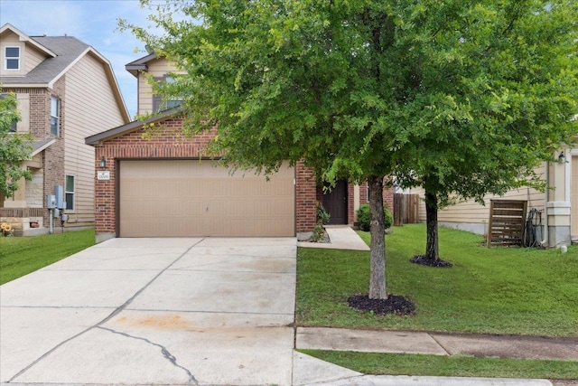 11009 Roderick Lawson Ln, Austin, TX 78754 - view of front of home featuring driveway, brick siding, a front lawn, and an attached garage