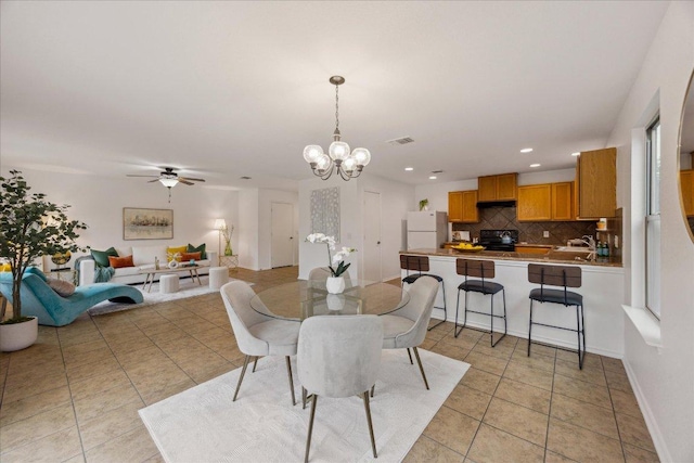 11009 Roderick Lawson Ln, Austin, TX 78754 - dining room with a chandelier, light tile patterned flooring, ceiling fan, and recessed lighting